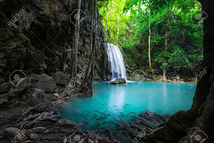 Waterfall in deep tropical rain forest