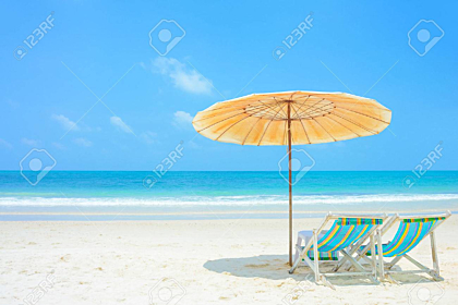 White sand beach with beach chairs