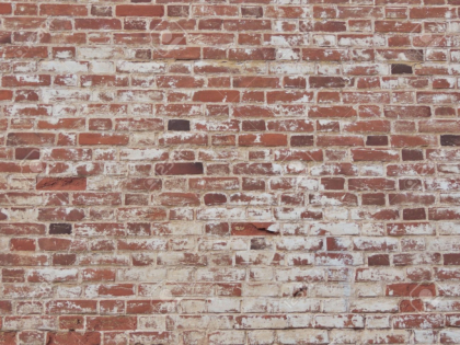 Red brick wall with shabby paint
